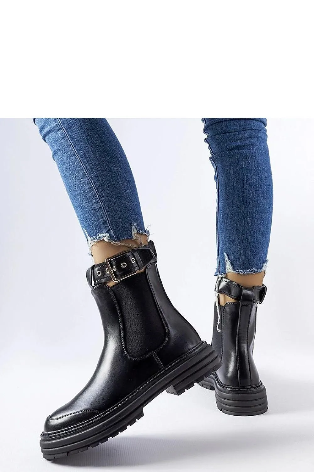 Black ankle boots with decorative fastening
