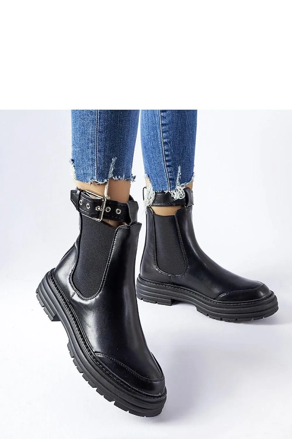 Black ankle boots with decorative fastening