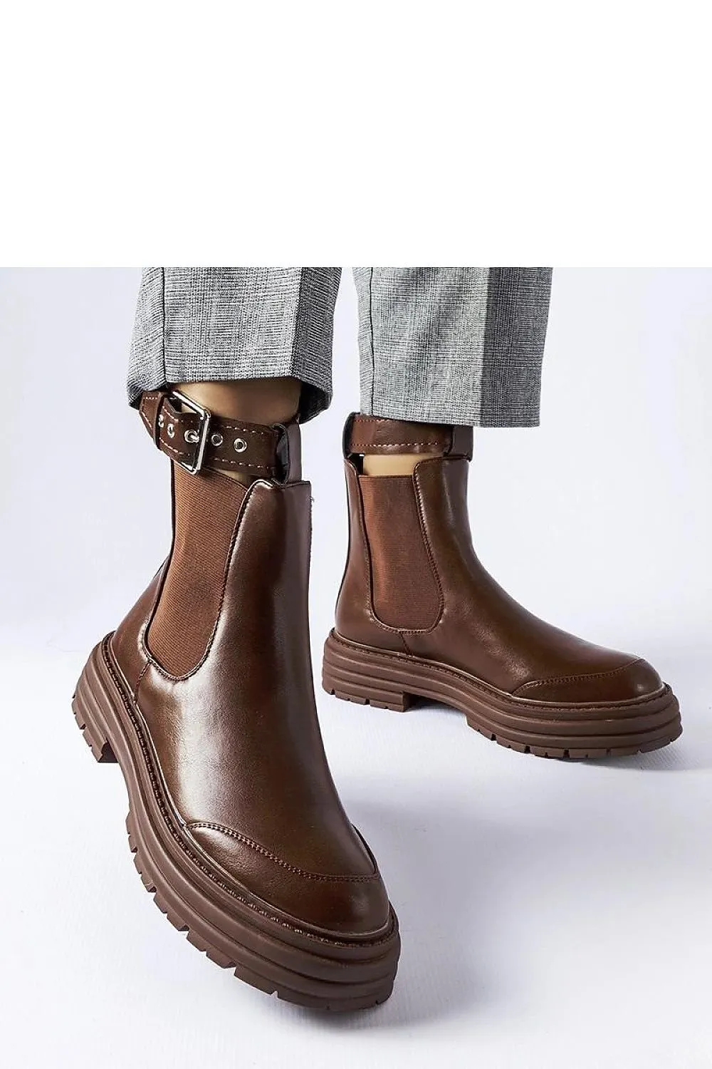 Black ankle boots with decorative fastening
